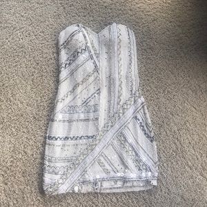 White, silver, and gold homecoming strapless dress